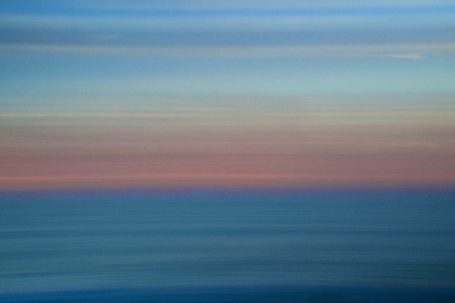 Soft pastel abstract ocean horizon in blue, violet, and pink
