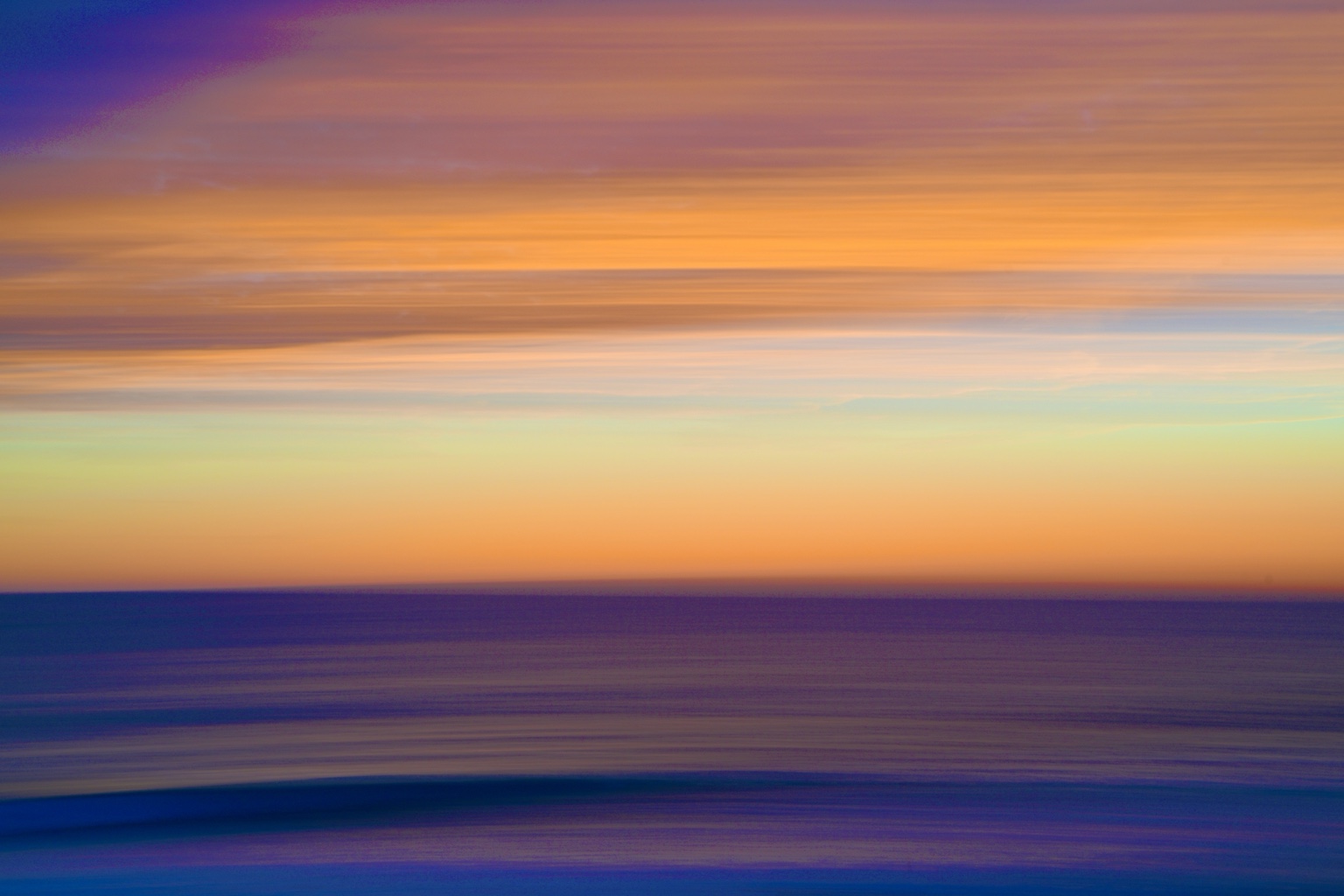 Ocean abstraction in violet, turquoise, and glowing orange